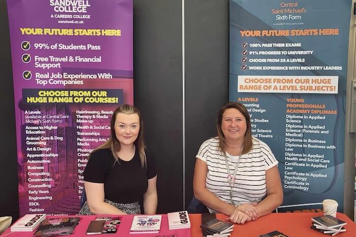 Two school liaison at an evnet
