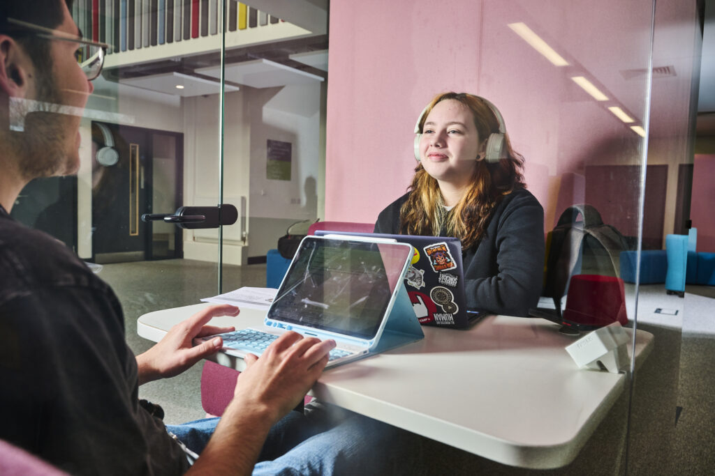 Students discussing in a learning pod