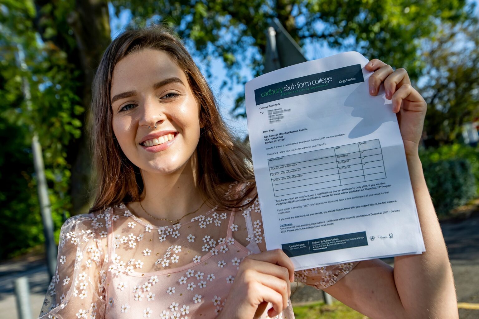 Skye holding up her results