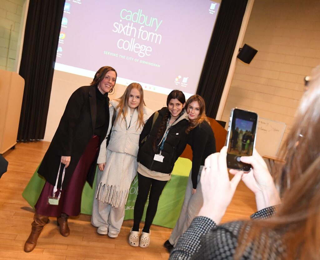 Jess Phillips MP having photo taken with three Cadbury Sixth Form College Politics students
