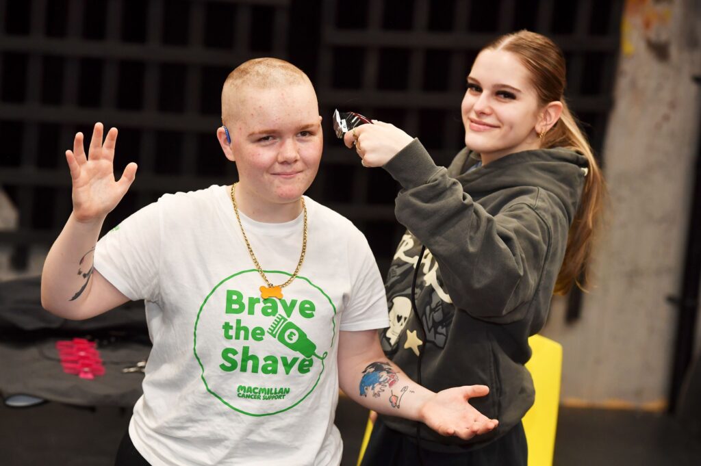 Hairdressing student shaves head of student Oliver for charity