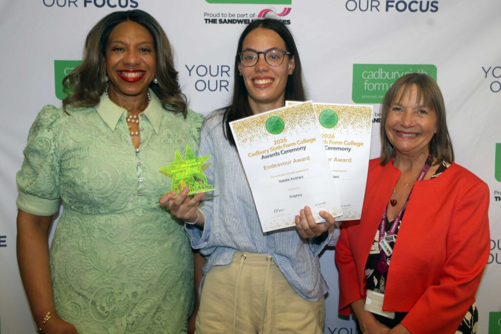 Student holding award certificates with guest speaker Deidre LaBassiere and college principal Lisa Capper MBE