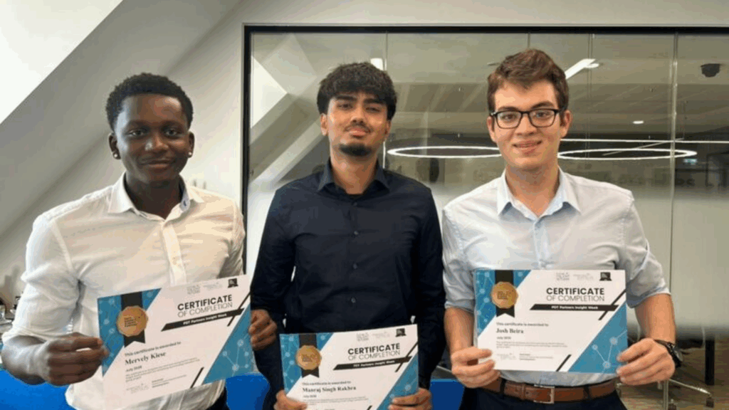Mervely receiving a certificate with colleagues